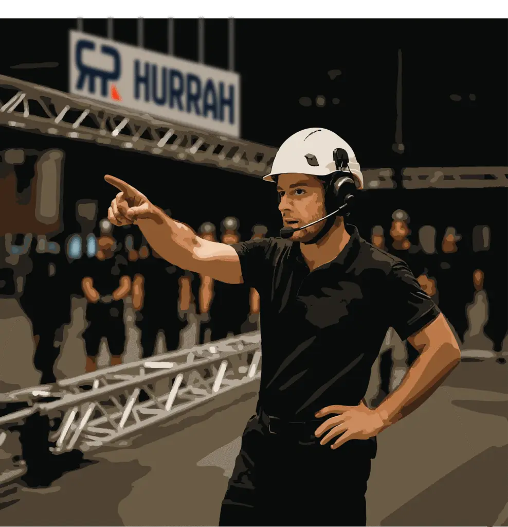 Technicien Hurrah dirigeant une équipe sur un montage d'une structure gonflable signalétique